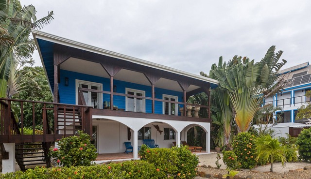 Beachfront home with dock, deck, hammocks, strong WiFi, AC & sea view