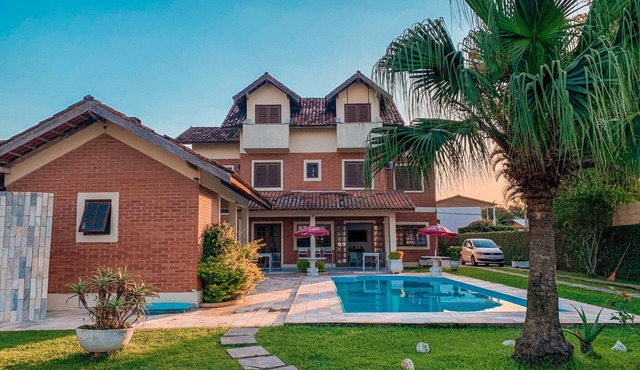 Beachfront house with pool for up to 20 people.