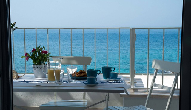Beachfront 2nd floor apartment with terrace located east with sunset