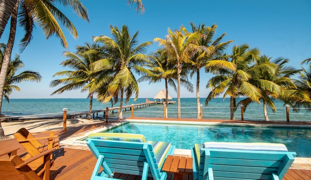 Beachfront, ocean-view getaway with shared pool, hammock, WiFi, & central AC