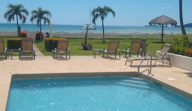 Beachfront one-bedroom, ocean view condo with toes in the sand!