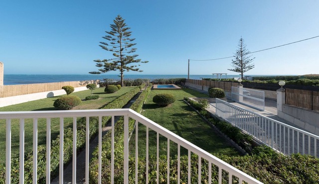 Beachfront property with garden, pool and splendid sea view