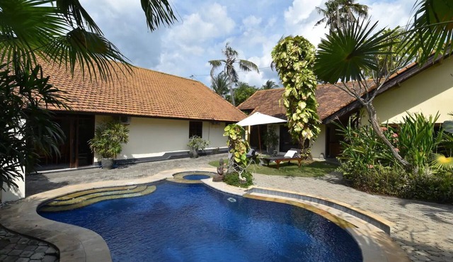 Beachfront villa with private pool, garden and terrace
