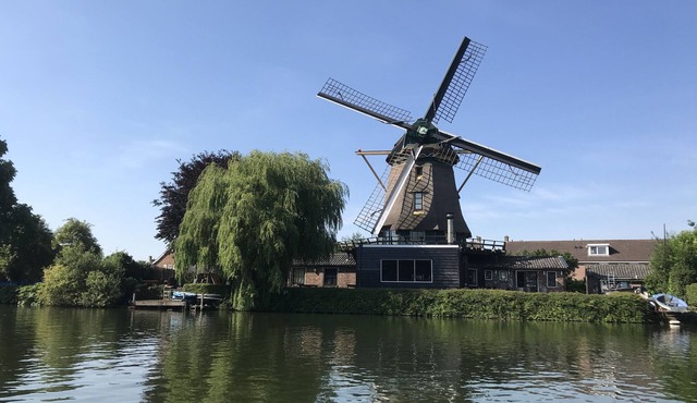 Beautiful original windmill along the riverside