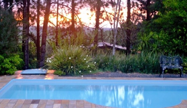 Beautiful site with swimming pool, court, barbecue, fireplace, large green area
