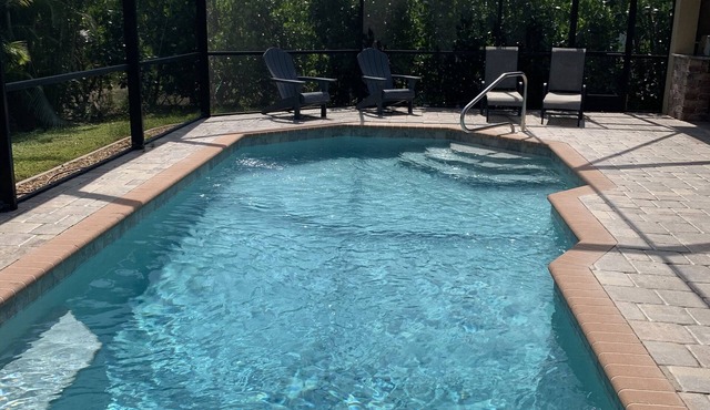 Beautiful spacious 3 bedroom/2 bath pool home with an outdoor kitchen