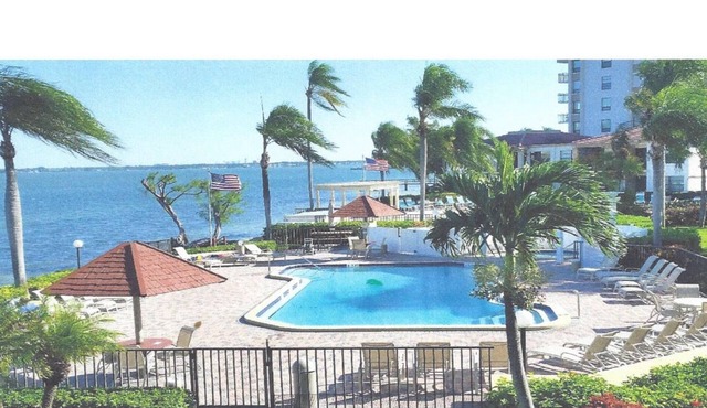 Beautiful water view apartment blocks from the beach. Excellent pool area.