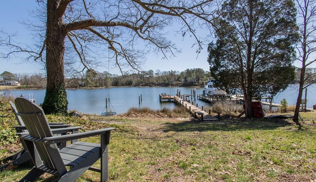 Beautiful waterfront home w/ dock, fire-pit & deck