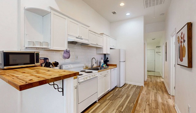 Boho duplex in a great location with smart TVs, well-equipped kitchen, W/D, & AC