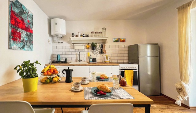 Boho-style apartment with private terrace in old city centre, tailored for 2