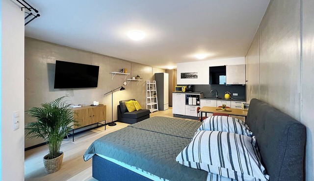 Bonquartier | Design apartment with balcony, parking space + charging station