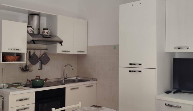 Bright one-bedroom apartment with kitchen near beaches and canal port.