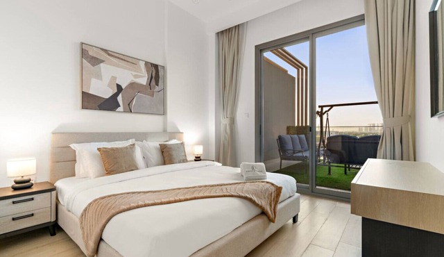 Bright 2BR Retreat | Balcony & Pool Near Jumeirah Village Circle