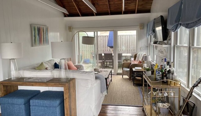Bright airy Fair Harbor home with ocean views steps from the soft sandy beach