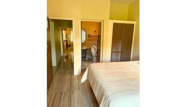 Bright and airy, the Eden Suite features a queen bed, ensuite bathroom, and balcony — a perfect retreat for couples or solo travelers.