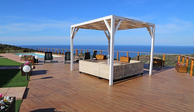 Bright villa with private pool, surrounded by lawn and sea view