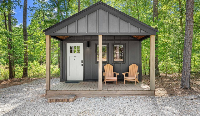 Cabin #7: One king-size bed, a kitchenette, and a large gravel parking pad beside the cabin for easy boat or trailer storage.