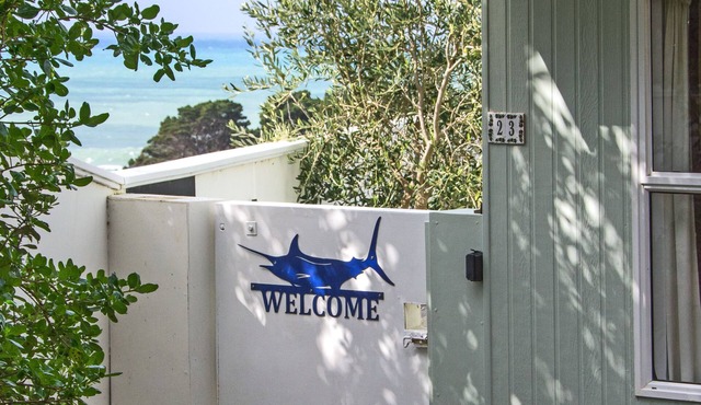 Castlepoint - Private family beach home with stunning views capturing the sun.