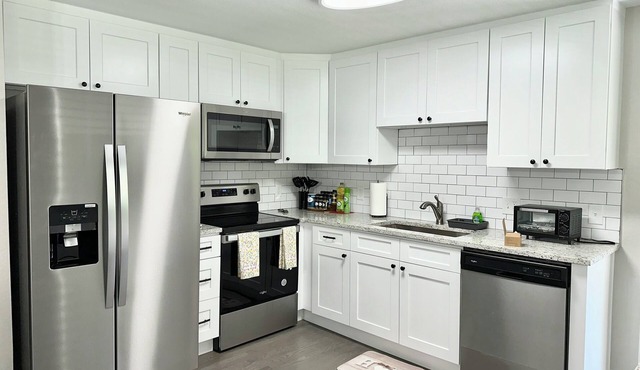 Central 5-BR Retreat with Basement Kitchenette & Convenient Freeway Access