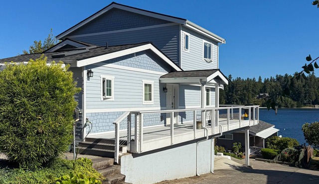 Centrally located waterfront home with ocean view, home office, grill, fireplace