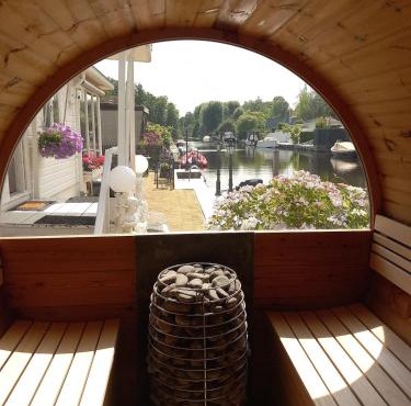 Chalet with waterfront sauna and boat