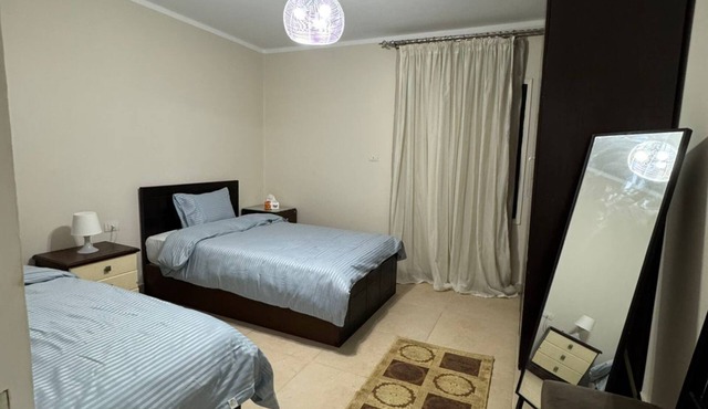 Charming 2-bedroom apartment with AC, WiFi in serene Cairo Governorate