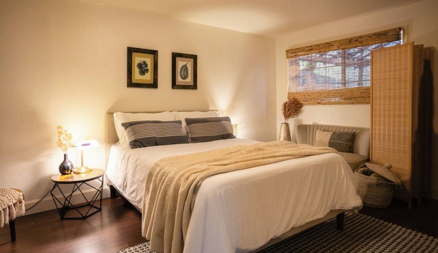Charming 2-bedroom riverfront cottage! Enjoy a wood stove, W/D, and private hot tub overlooking the Rogue River. Perfect Gold Hill getaway for couples or a small family retreat.