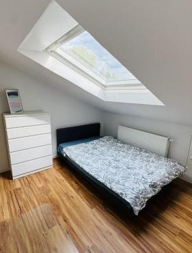 Charming Attic Retreat with Sloped Roof