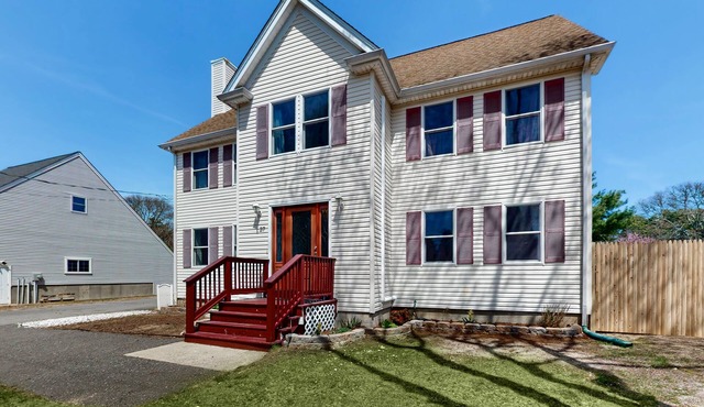 Charming coastal home with sunny rooms, private backyard, & walk to beach