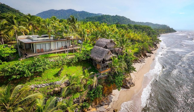 Charming oceanfront cabin with stunning views, private terrace, and beach access