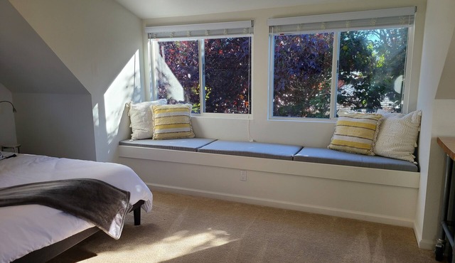 Charming private upstairs studio with queen bed