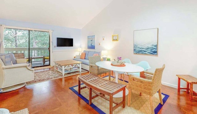 Charming second-floor retreat with a full kitchen and balcony view