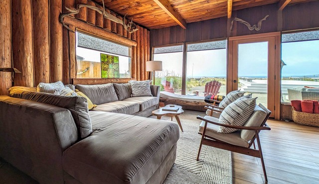 Charming water view retreat with a wood-burning fireplace, deck, grill, and W/D