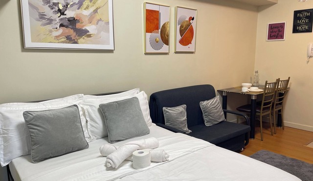 Chic condo in marvelous Manila with parking, fitness room, WiFi near US Embassy