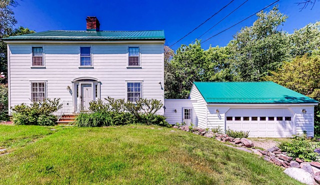 Classic waterfront retreat with a grill, firepit, four bedrooms, W/D, and AC