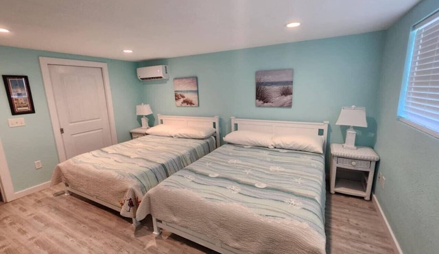 Coastal 1BR – Bayfront Views, Porch, Fishing & Walkable Lighted 1.5-Mile Seawall