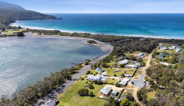 Coastal getaway in an unbeatable location steps from the region's top surf beach