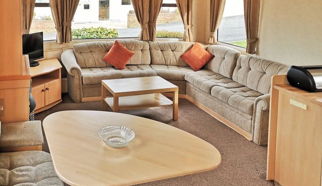 Comfortable and spacious 12ft-wide caravan with one double and two twin.