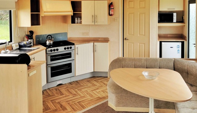 Comfortable and spacious 12ft-wide caravan with one double and one twin.