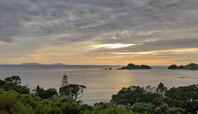 Comfortable bach with stunning views over a beautiful beach