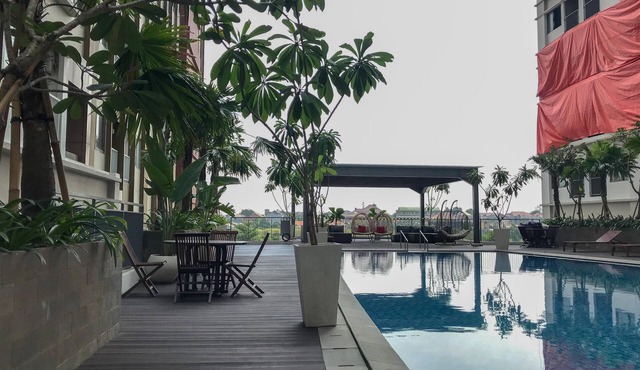 Comfortable Pool View Studio Room at LRT City Jatibening Apartment
