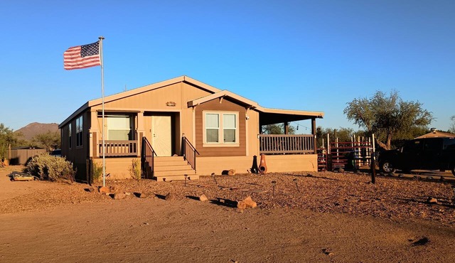 Comfortable two-bedroom house only 30 minutes from downtown with horse stalls.