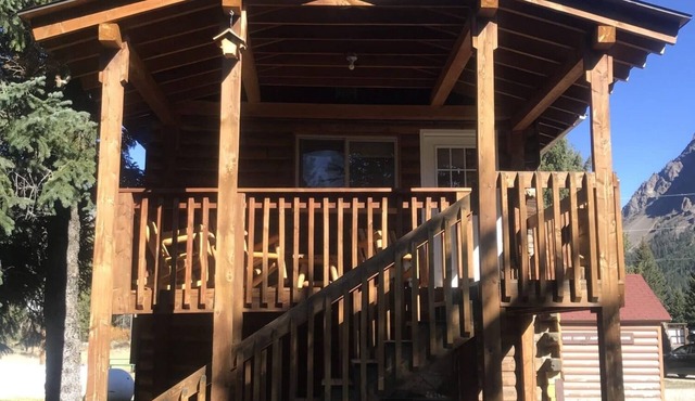 Comfy cabin is situated on the Silver Gate property which overlooks 10,000ft tall mountain peaks surrounding the town.