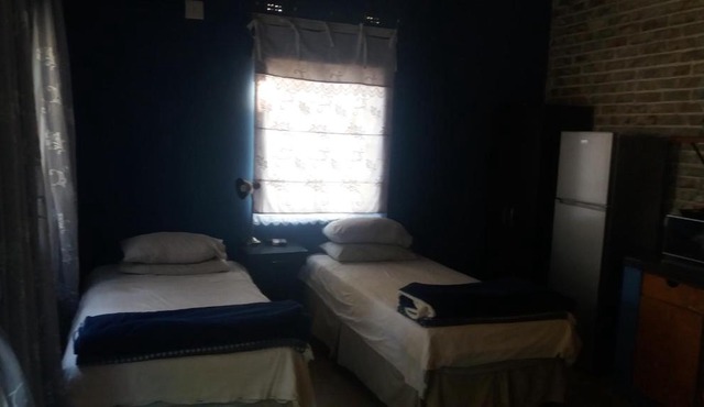 Comfy room with dstv and aircon in convenient location