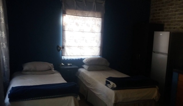 Comfy room with dstv and aircon in convenient location