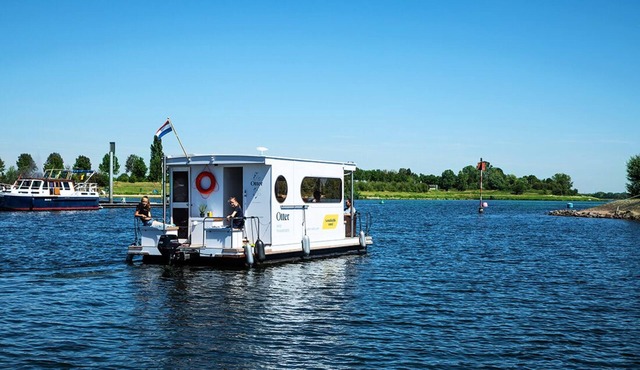 Compact Houseboat sailing and stationary for rent. No boating license required