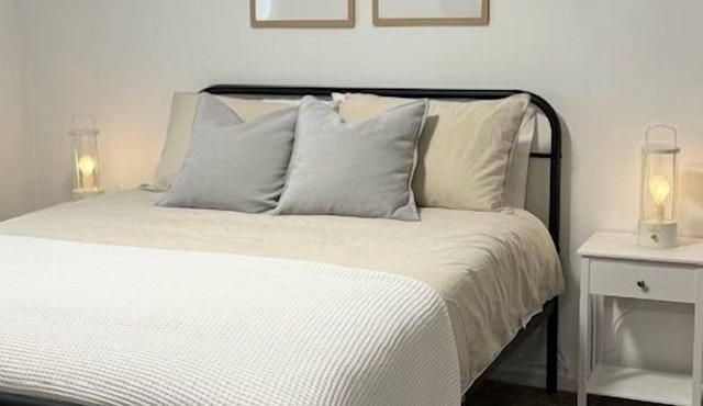 Completely Renovated home comfortably accommodates your stay with a queen bed in the primary bedroom, a twin bed with a pull-out trundle in the second bedroom, and a sleeper sofa in the living room for additional guests.