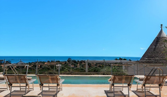 Complex of trulli with private pool overlooking the sea