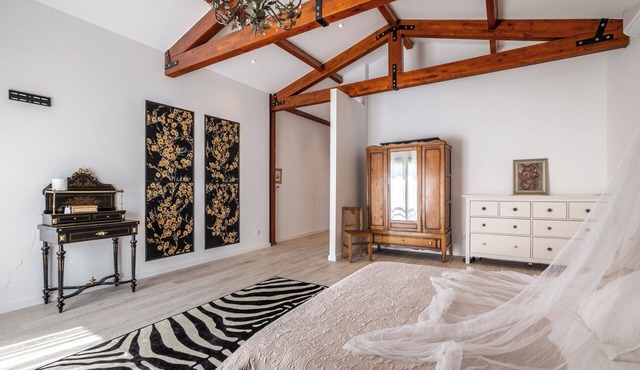 Contemporary rural villa with large wooden beams with artistic accents