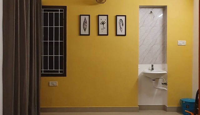 Convenient shared room in a 2bhk with all amenities at value in central Chennai.